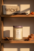 Wicke candle with a purple lid on a white background