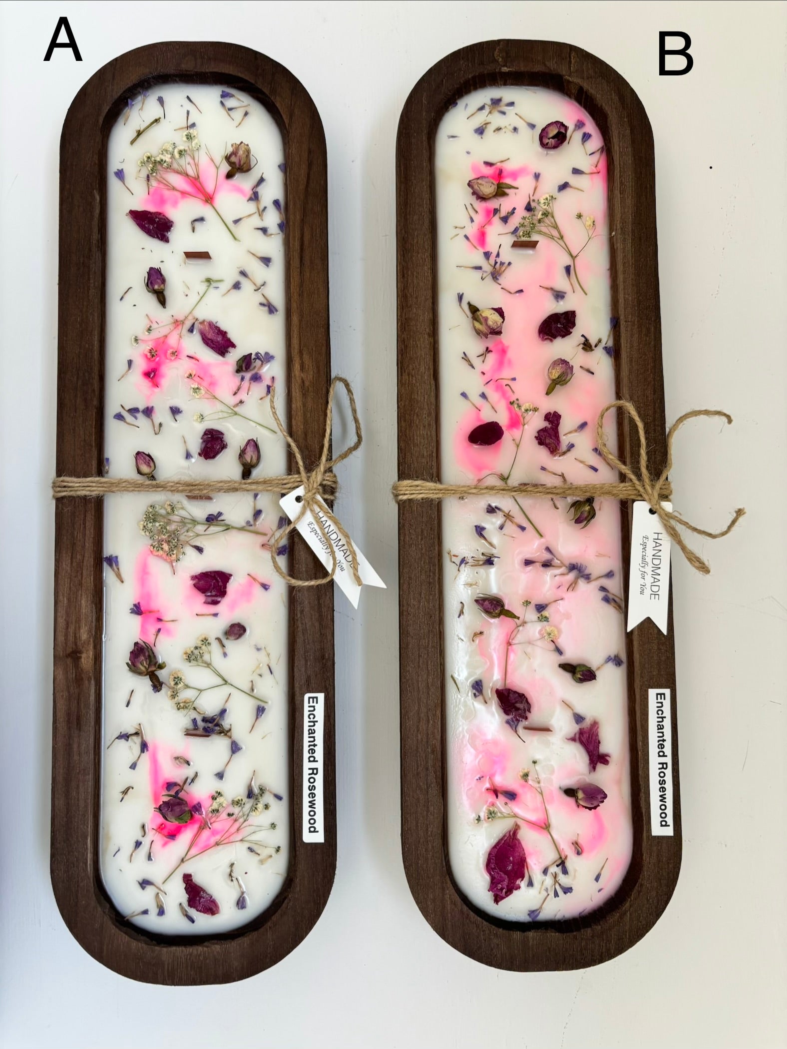 Two rectangular wooden trays containing white wax with embedded pink and purple dried flowers, tied with twine and labeled 'poisoning resistance' on a white background.