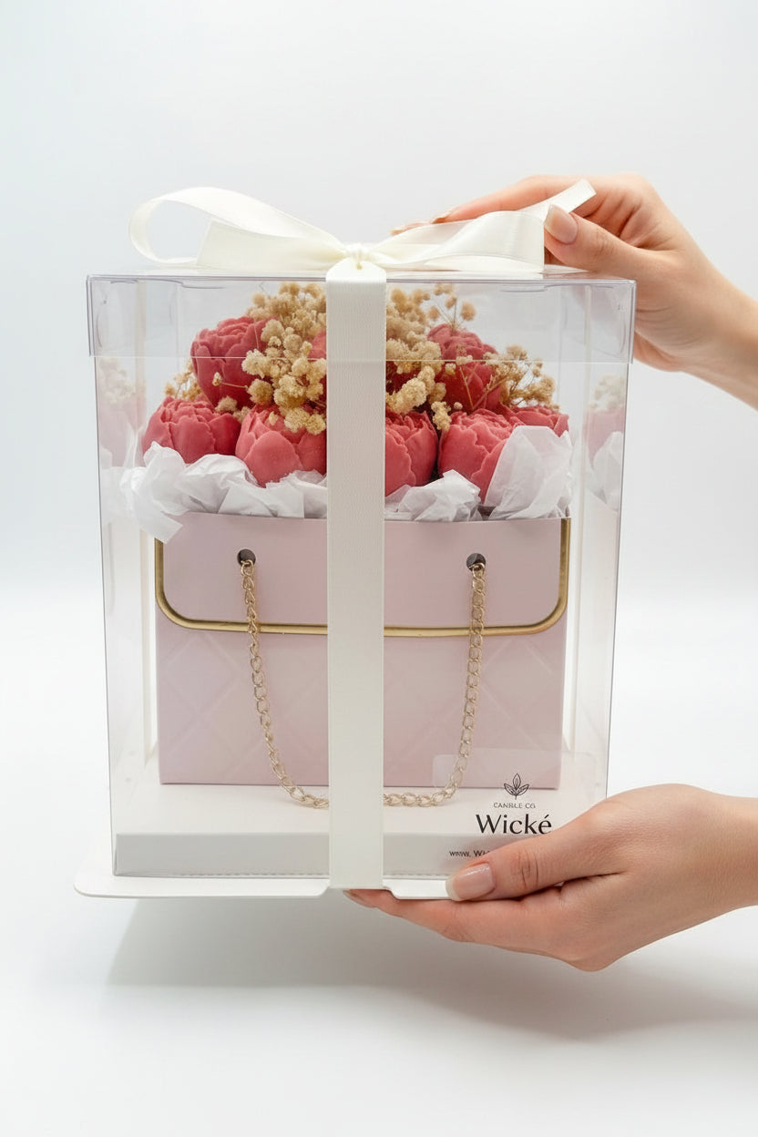 Floral arrangement in a decorative box with 'Wicke' branding on a white background