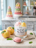 Wicke Peach of My Heart candle with peaches and a spoon on a wooden board in a bakery setting.